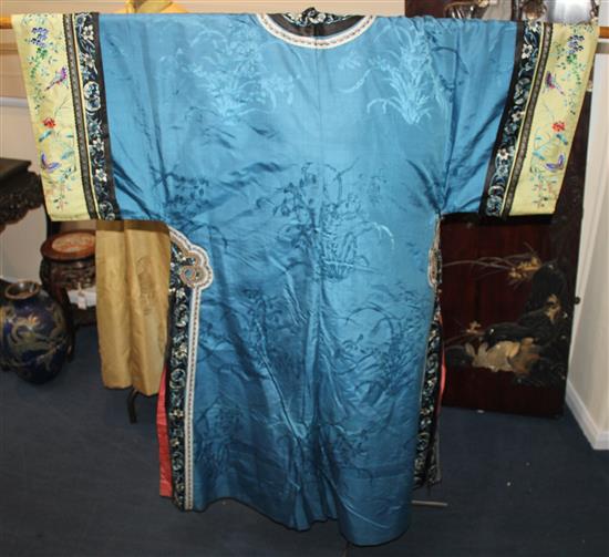 A Chinese blue silk, damask and embroidered ladys robe, late 19th / early 20th century,